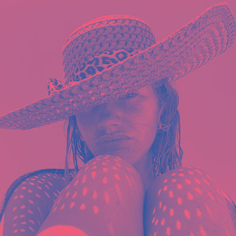 Duotone image of a girl in hat